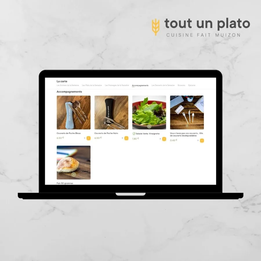 Site Tout Un Plato sur ordinateur portable : rubrique accompagnements de la carte avec photos, prix et ajout au panier